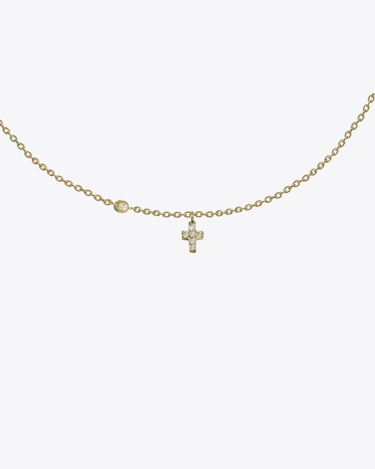 Collier Mini croix en or 18 carats + diamants Feidt Paris. 