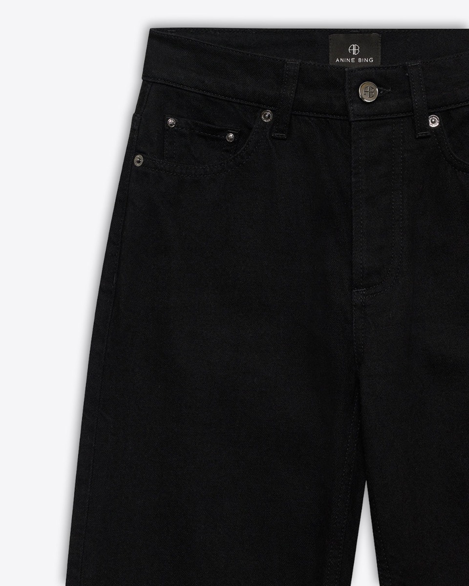 Produit Jeans taille haute Bruno Anine Bing en toile noire. Détail des rivets.