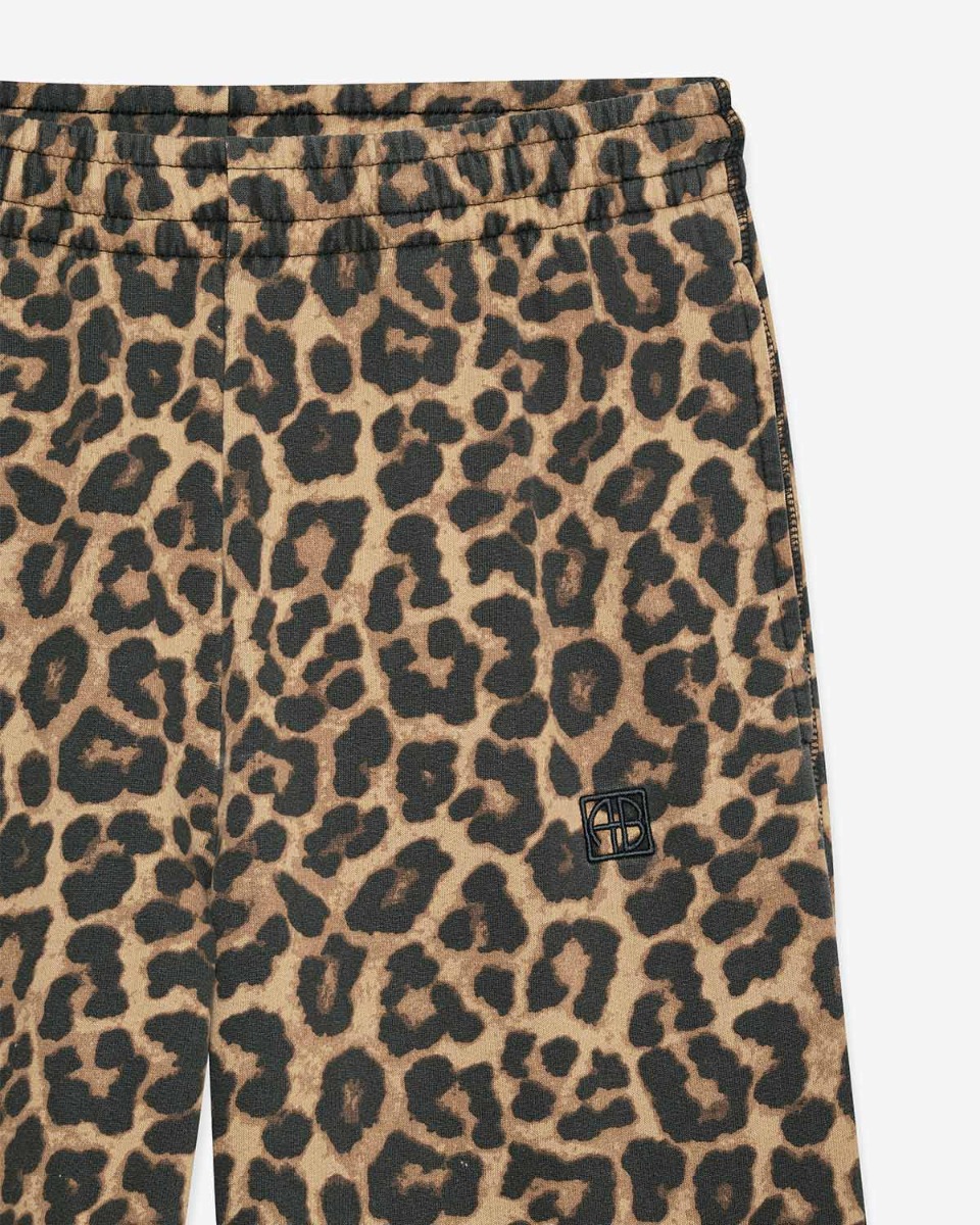 Pantalon de jogging Karter Anine Bing en coton imprimé léopard. Détail de la ceinture élastiquée.