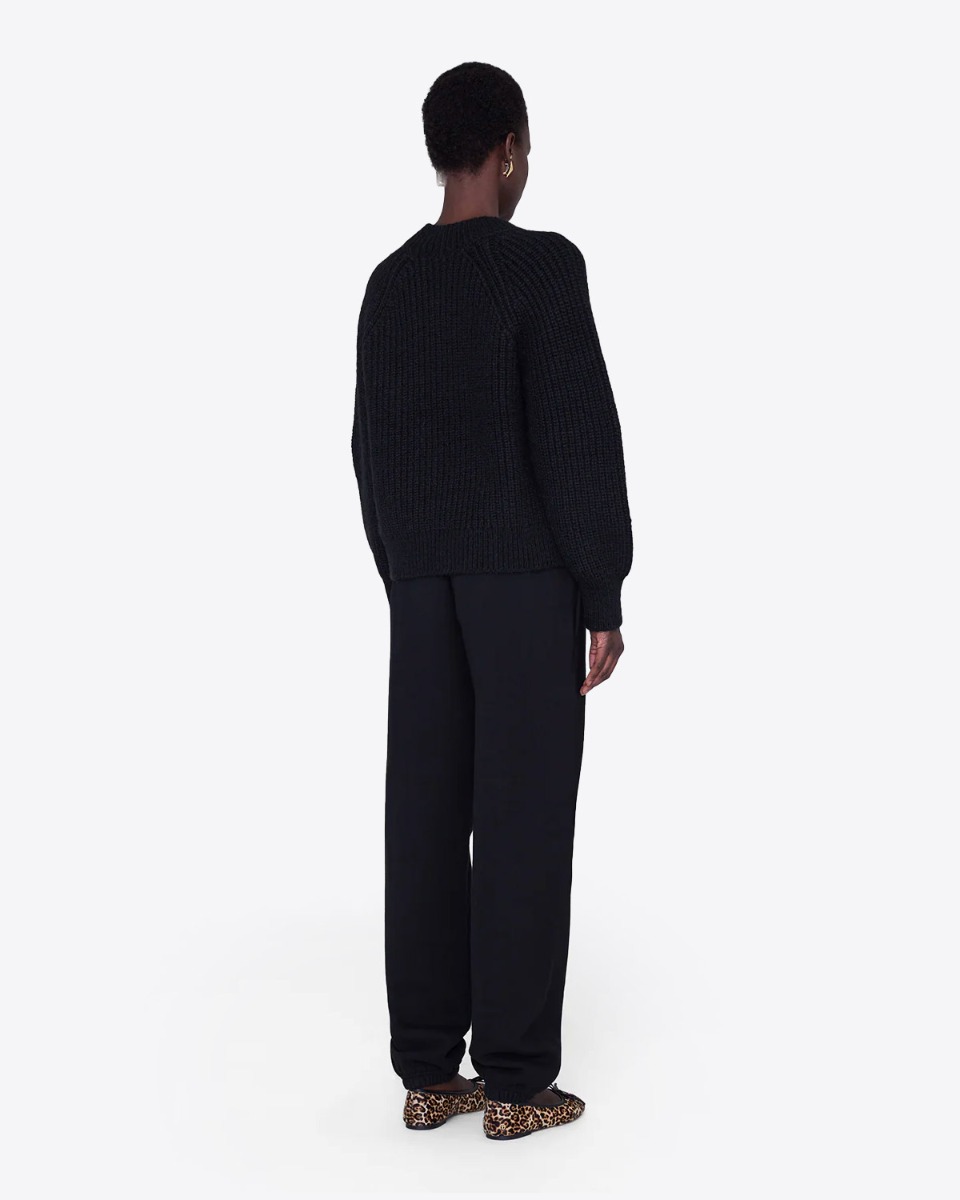 Pantalon de survêtement de jogging Karter Anine Bing en coton noir, porté de dos.