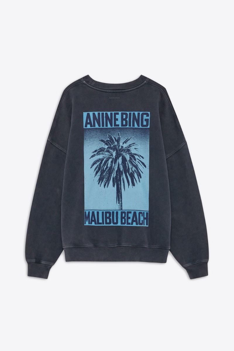 Sweatshirt Miles Palm Anine Bing en coton noir délavé sérigraphier palmier bleu dans le dos, logo « ANINE BING » sur le poitrine vue de dos.