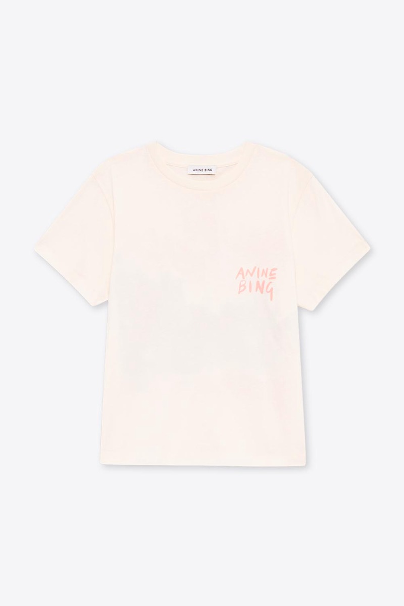 Tee-shirt manches courtes Shelley Surfer Anine Bing en coton cr&egrave;me et s&eacute;rigraphie rose poudr&eacute; &laquo; ANINE BING &raquo; sur la poitrine, vue de face.