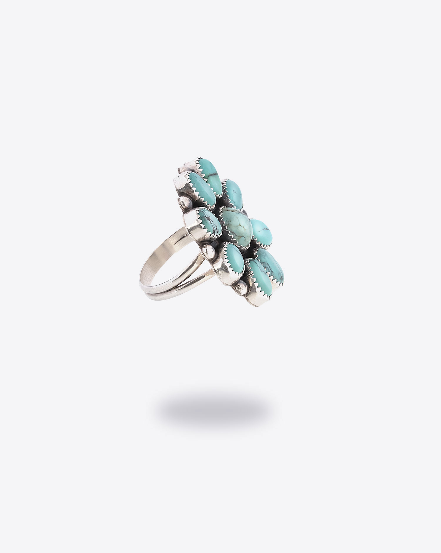 Produit Bague ML Perry Harpo en forme de fleur avec pierres turquoises. 