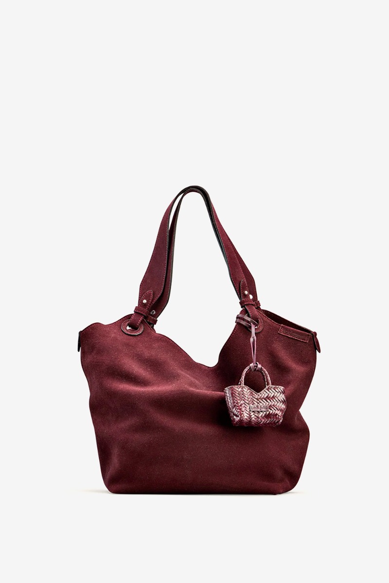 Charm Humi Micro Cala Jade en cuir tress&eacute; Fudge port&eacute; sur un sac attach&eacute; &agrave; la anse.  