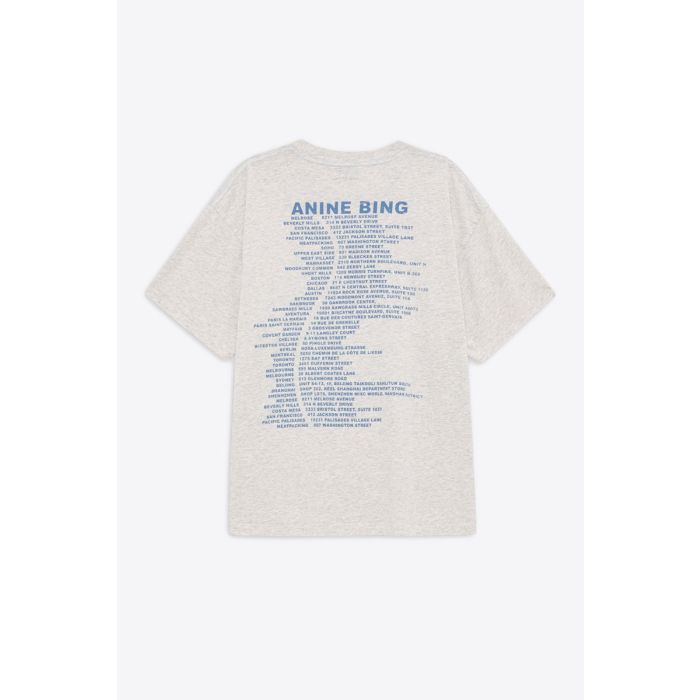 Tee-shirt Cade Wave Anine Bing en jersey gris clair chiné et logo stylisé Anine Bing bleu sur le poitrine et sérigraphie bleu dans le dos.
