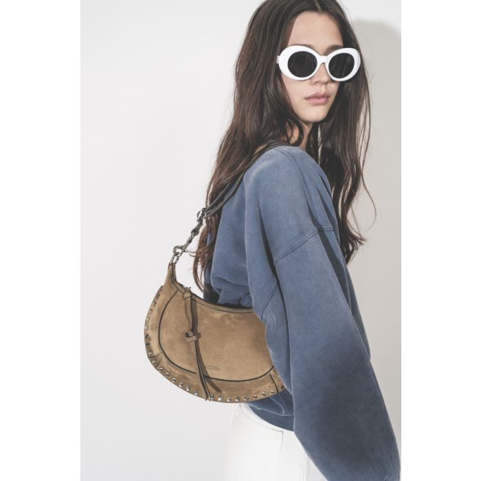 Sweatshirt Sauria Isabel Marant Étoile en coton bleu indigo, porté de profil.