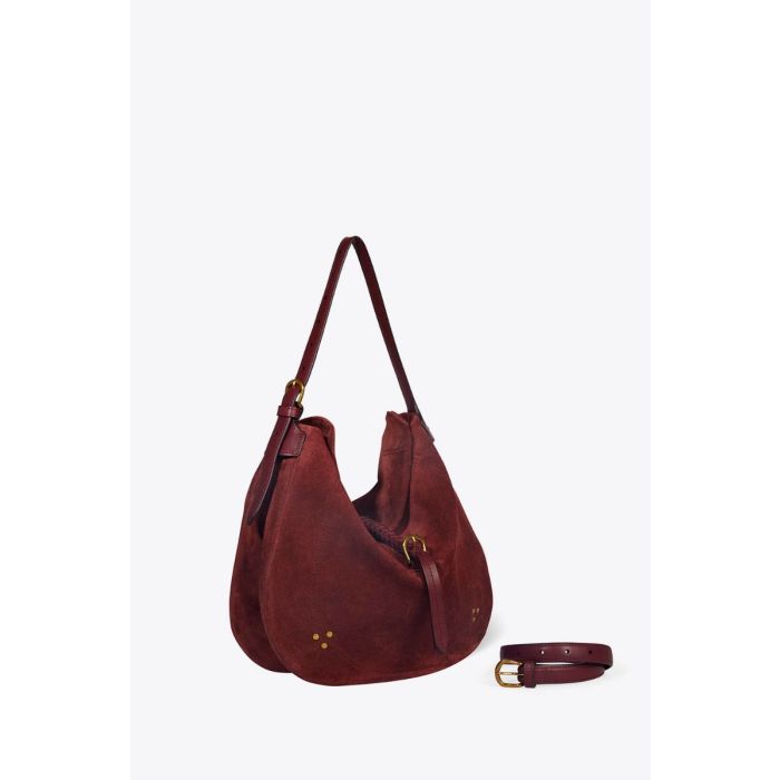 Sac besace Luis Jérôme Dreyfuss en cuir suédé brulé. Vue de profil avec la sangle grâce à laquelle il se porte long.