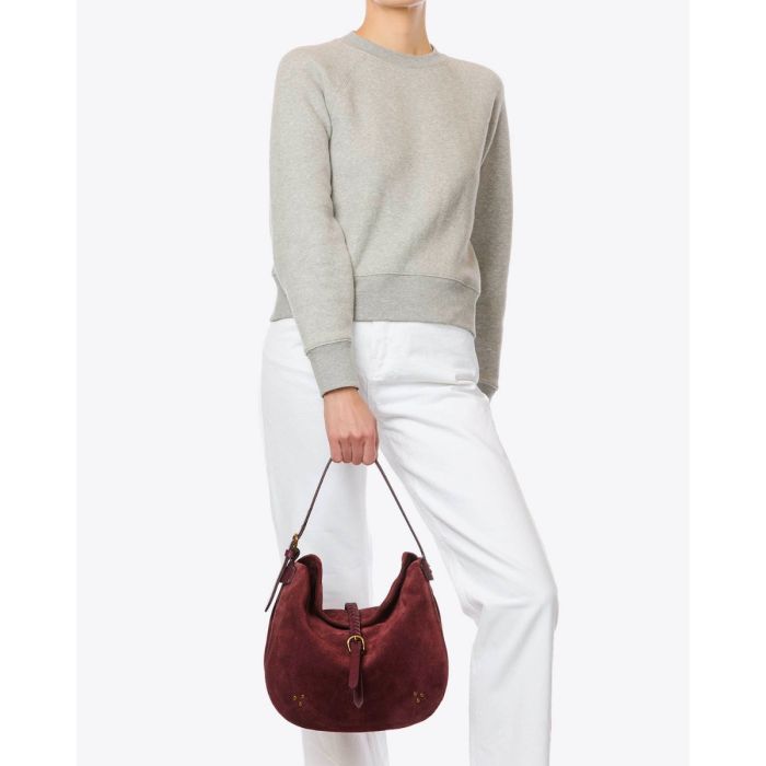 Sac besace Luis Jérôme Dreyfuss en cuir suédé brulé, porté de face bandoulière courte pour un porté à la main.