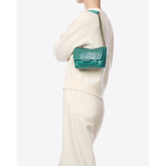 Sac Lulu S Jérôme Dreyfuss en cuir turquoise, porté court à l'épaule.