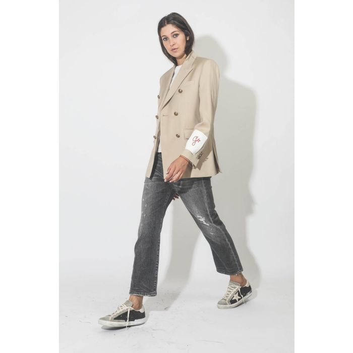 Veste double boutonnage en laine froide beige clair Golden Goose. Porté de profil.