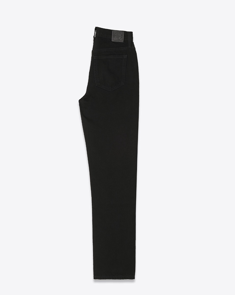 Jeans slim taille haute Bruno Anine Bing en toile noire. Vue de profil. 