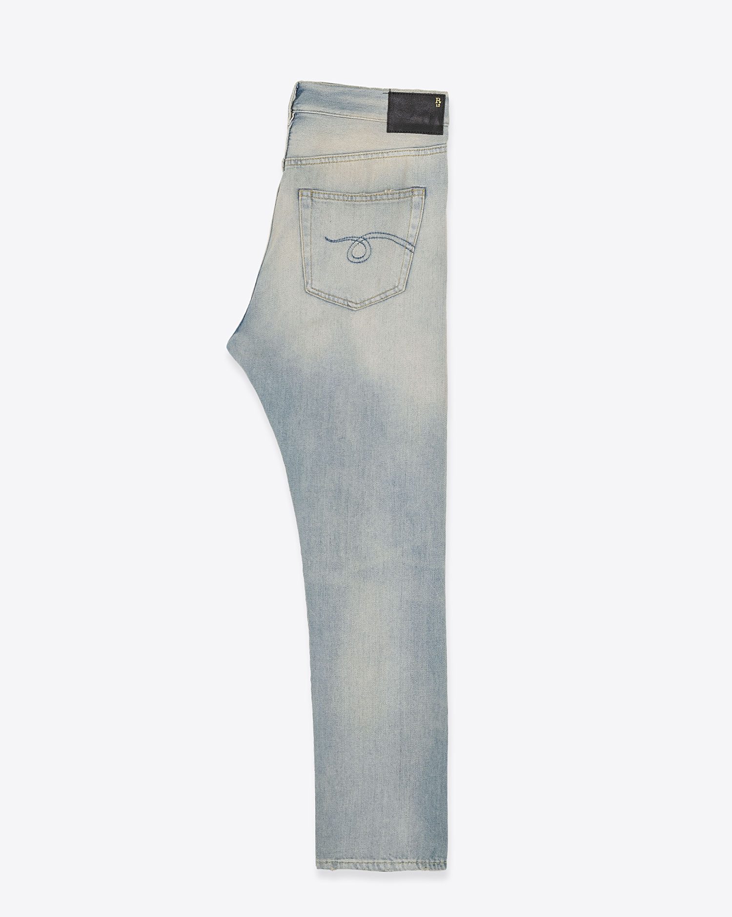 Jean Crossover R13 en denim coton délavé. Vue profil.