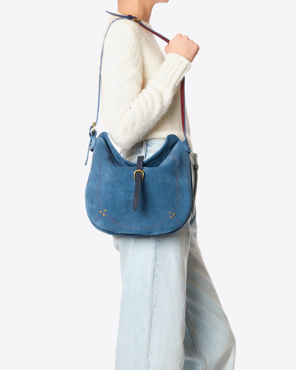 Sac Luis Jérôme Dreyfuss en cuir effet jean porté sur l'épaule.