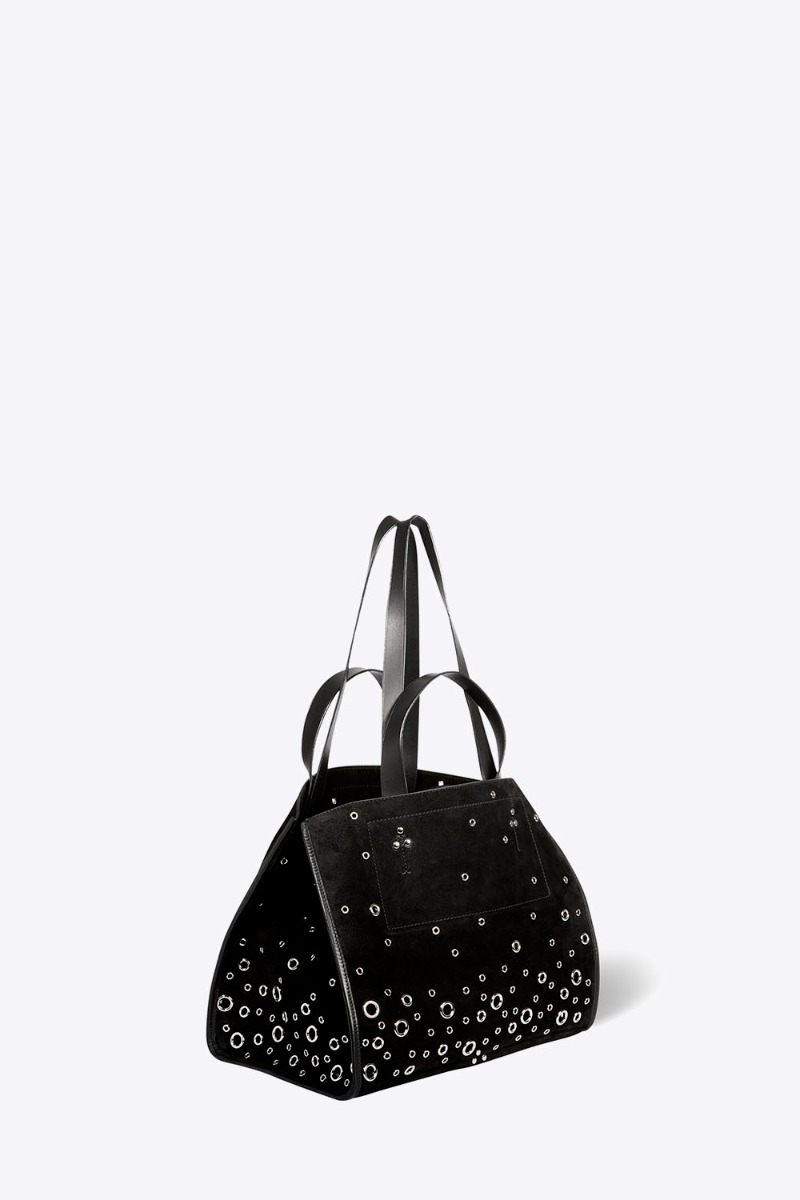 Sac cabas L&eacute;on M J&eacute;r&ocirc;me Dreyfuss en cuir su&eacute;d&eacute; noir et &oelig;illets en m&eacute;tal argent&eacute; Tandem. Vue de profil avec les anses courtes et longues pour un port&eacute; &agrave; l&rsquo;&eacute;paule ou &agrave; la main. 