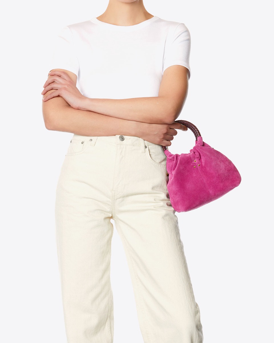 Sac bourse Gordi S Jérôme Dreyfuss en cuir suédé rose orchidée porté main.