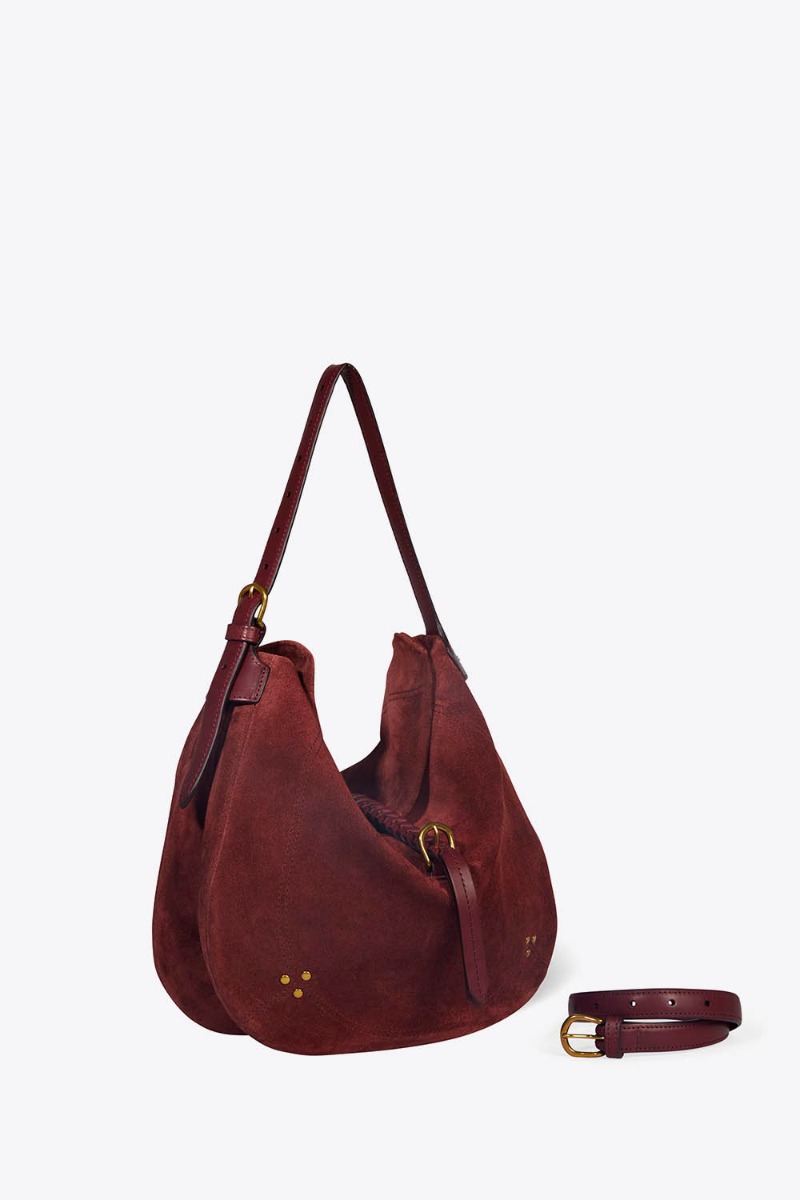 Sac besace Luis J&eacute;r&ocirc;me Dreyfuss en cuir su&eacute;d&eacute; brul&eacute;. Vue de profil avec la sangle gr&acirc;ce &agrave; laquelle il se porte long.