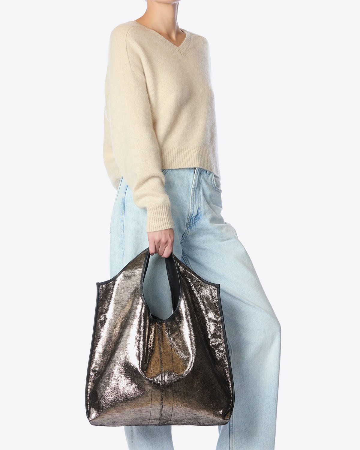 Sac Paco Jérôme Dreyfuss en cuir lamé champagne. Vue porté main. 