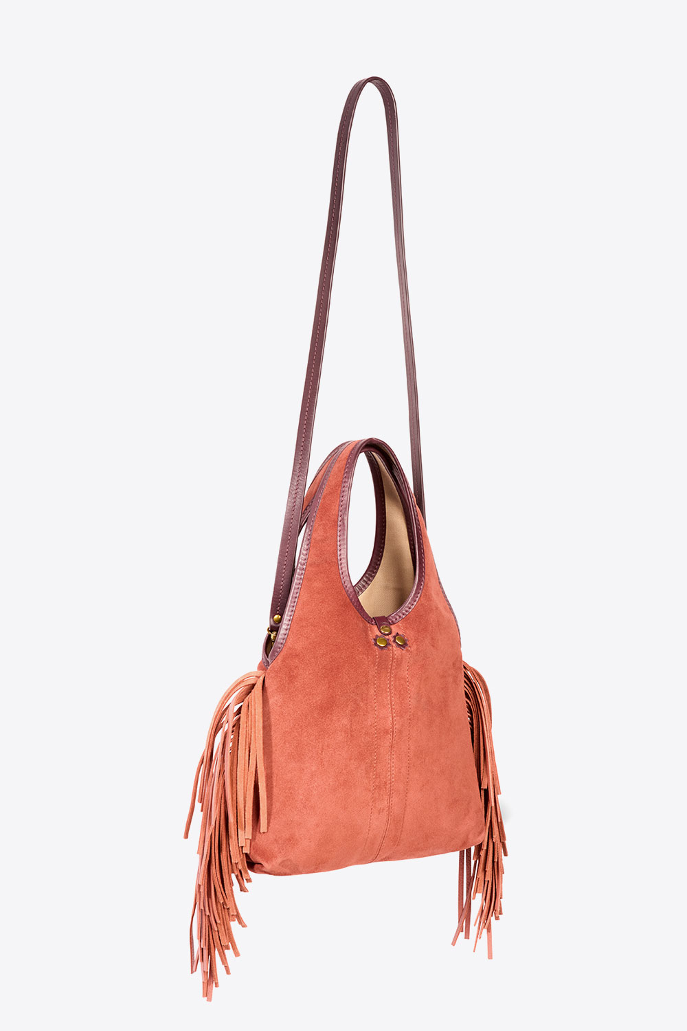 Produit Mini-sac à franges bandoulière amovible en cuir suédé Haenyeo Terracotta Jérôme Dreyfuss. Capsule SS25. Détail de la bandoulière amovible en cuir contrasté. 