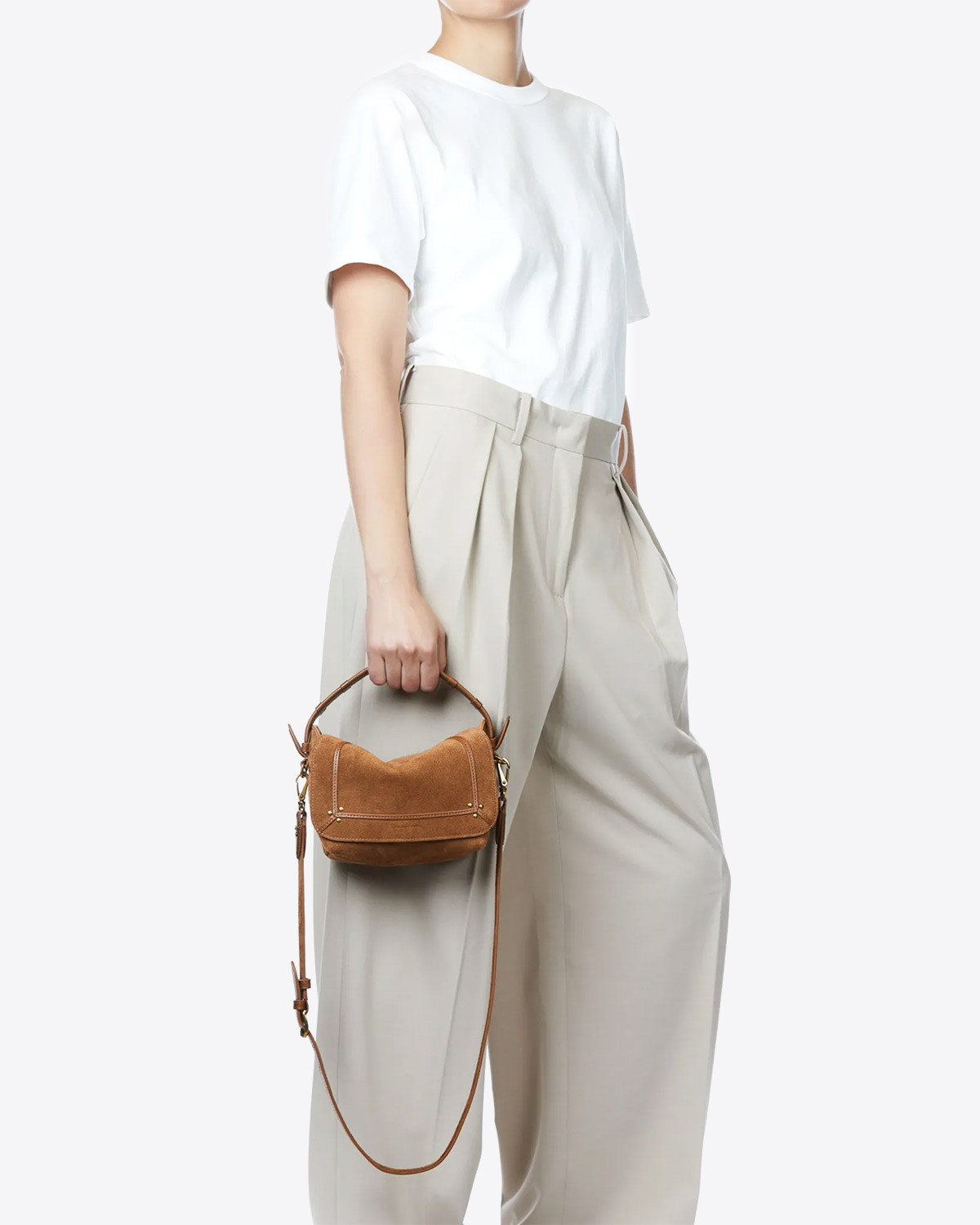 Petit sac besace Pepito S Jérôme Dreyfuss en cuir tabac. Porté main avec anse. 
