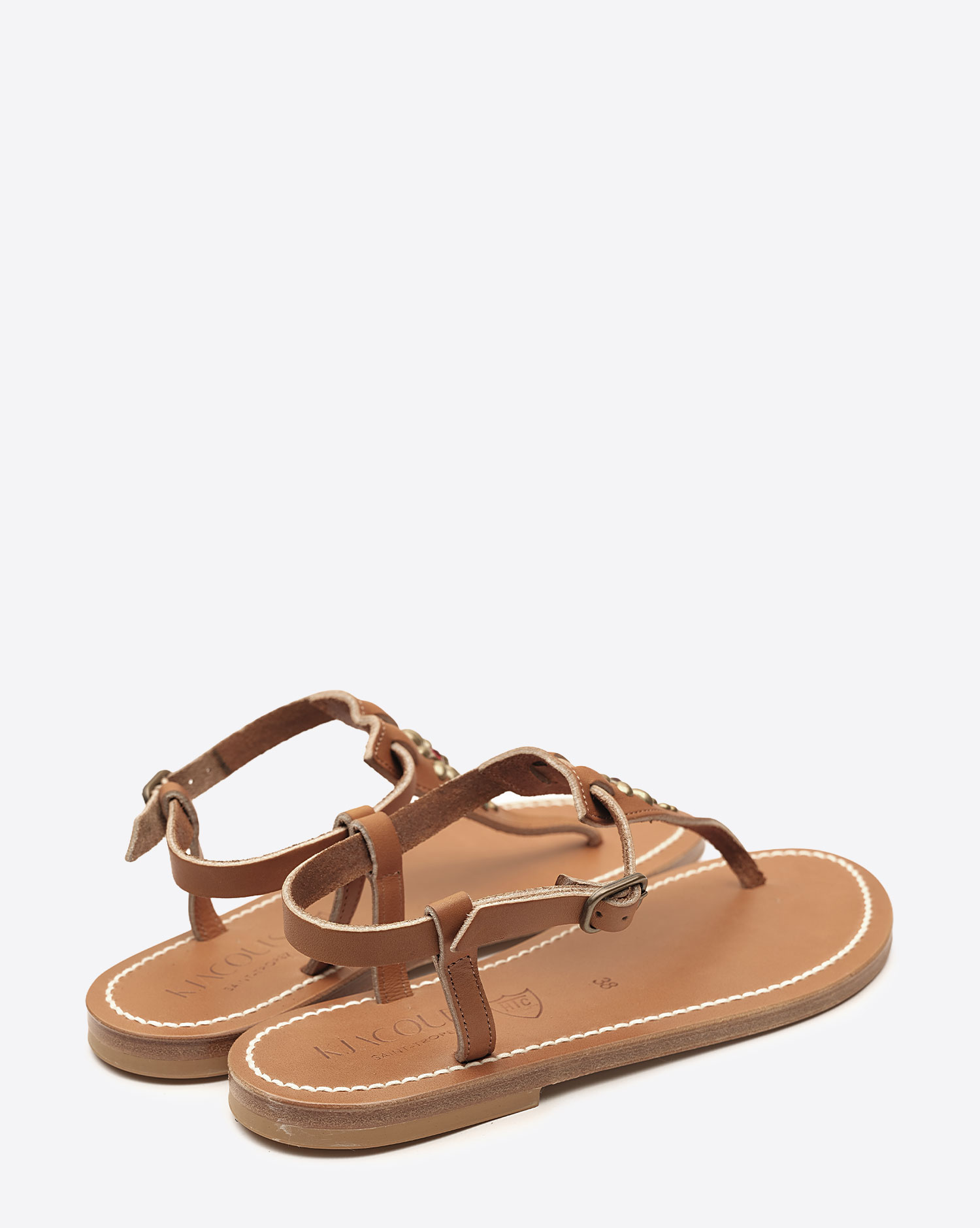 Sandales Coriolan K.Jacques x HTC en cuir noir, ornées de clous métalliques argentés et de pierres colorées formant une fleur, fabrication artisanale française. Vue de dos.