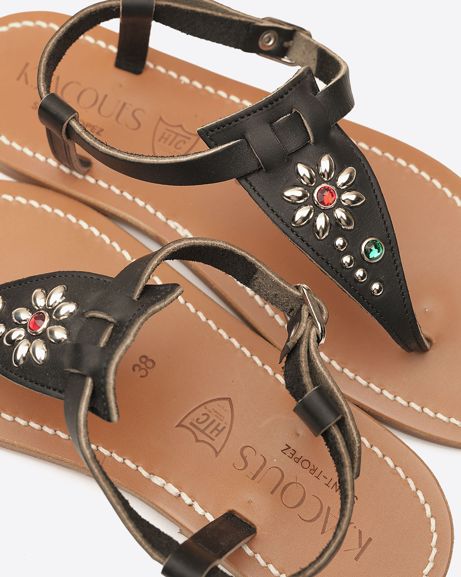 Sandales Coriolan K.Jacques x HTC en cuir noir, ornées de clous métalliques argentés et de pierres colorées formant une fleur, fabrication artisanale française. K.Jacques St-Tropez customisé par HTC.