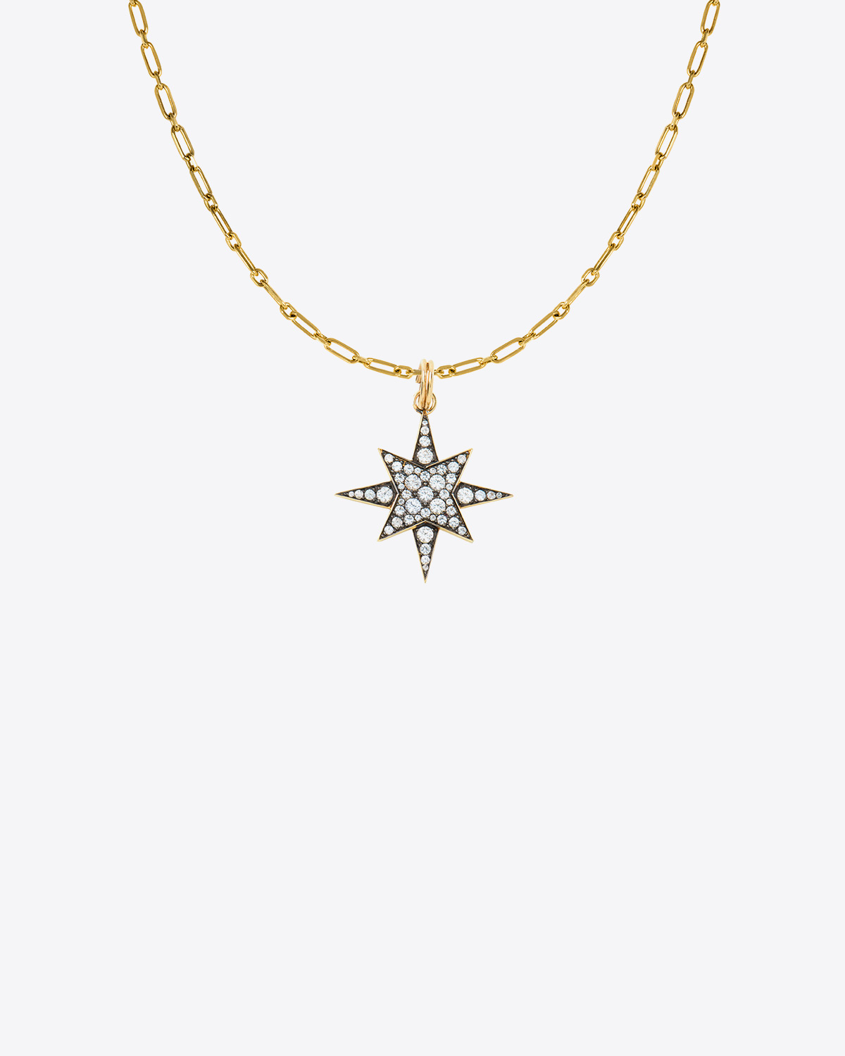 Pendentif étoile en or 9 carats et saphirs blancs Feidt Paris.  