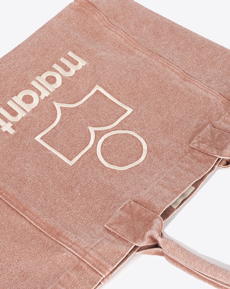 Produit Sac cabas Yenky Small Isabel Marant en toile délavée Rust logo brodé blanc devant. Porté main ou épaule. Détail de la toile et du logo "MARANT" brodé devant.