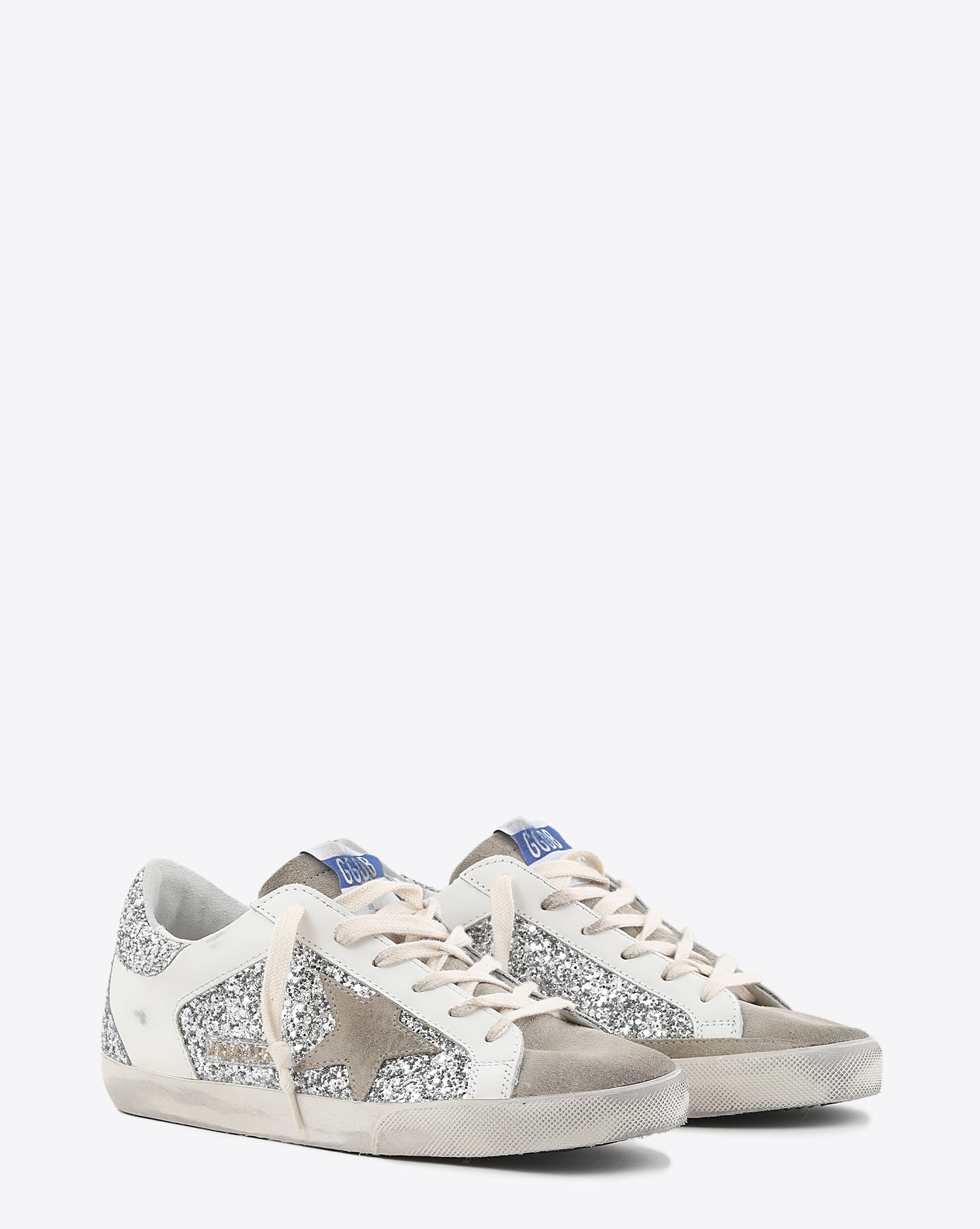 Sneakers Super-star femme en cuir blanc et paillettes argent 81773 Golden Goose. 